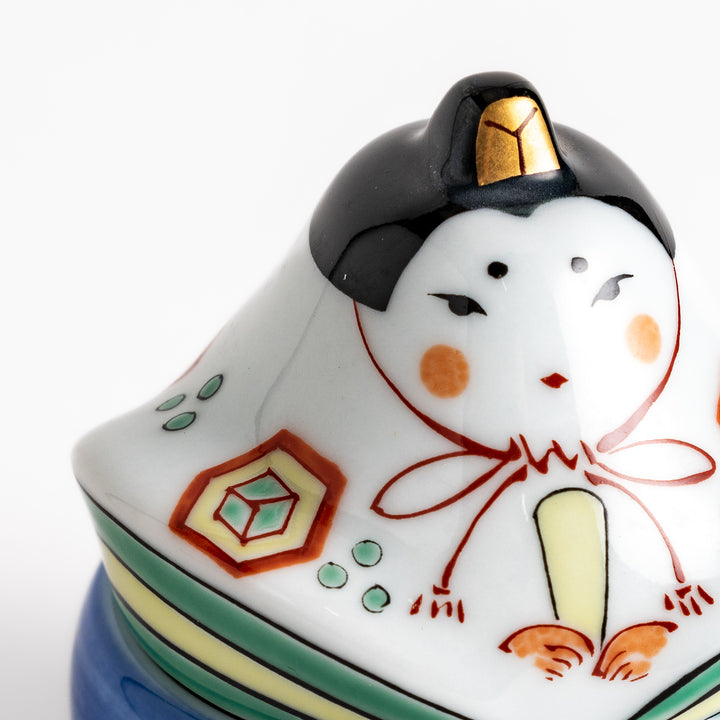 Ceramic condiment bowl with a charming traditional Japanese doll design, perfect for serving small portions of spices, sauces, or snacks.