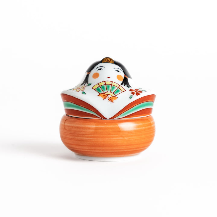 Orange and white ceramic condiment bowl with a charming Japanese doll design, perfect for adding a touch of whimsy to your table setting.