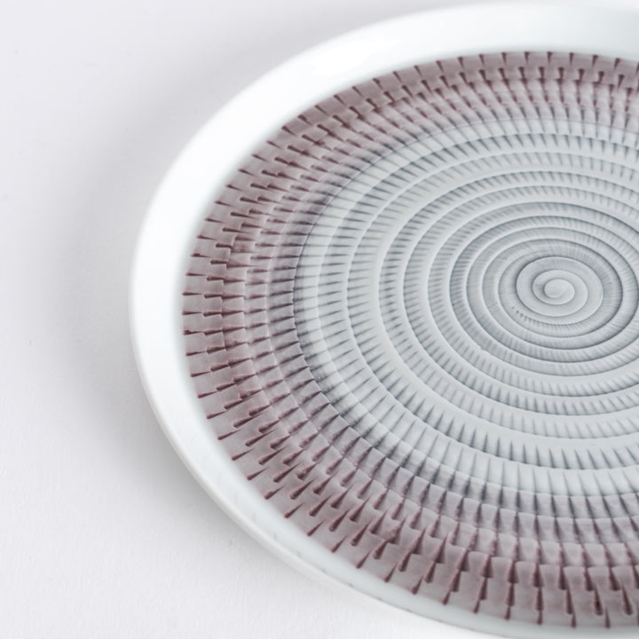 Close-up of the intricate light purple spiral pattern, radiating outwards with fine detail.