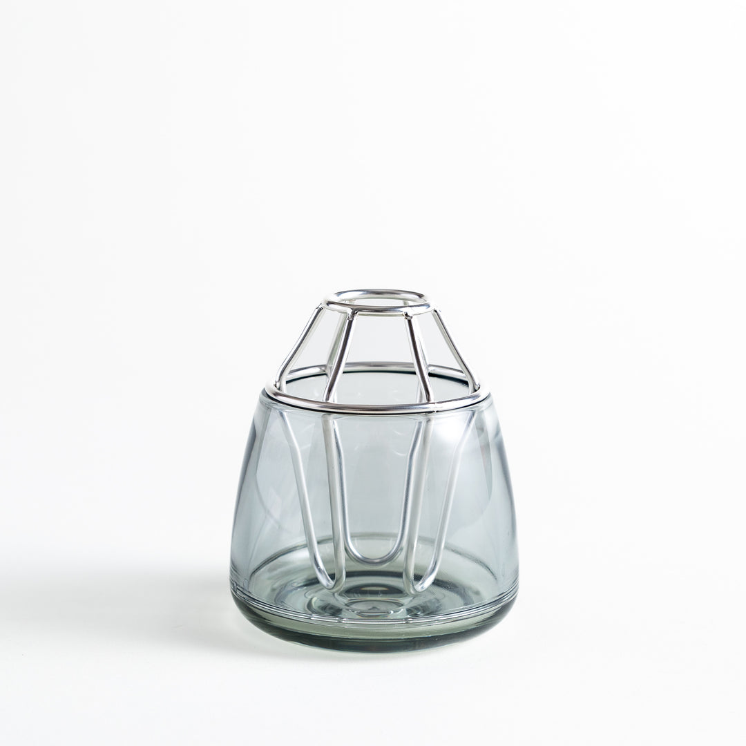 Glass vase with the silver frame attached, showing its clean and elegant structure.