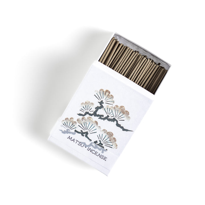 Incense featuring earthy brown sticks in a box adorned with a traditional pine tree design, offering a fresh, woody fragrance reminiscent of evergreen forests.