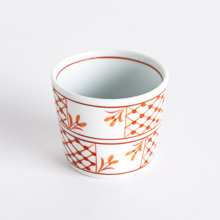 A condiment bowl featuring a geometric pattern of flowers within triangles, available in blue or red ink.