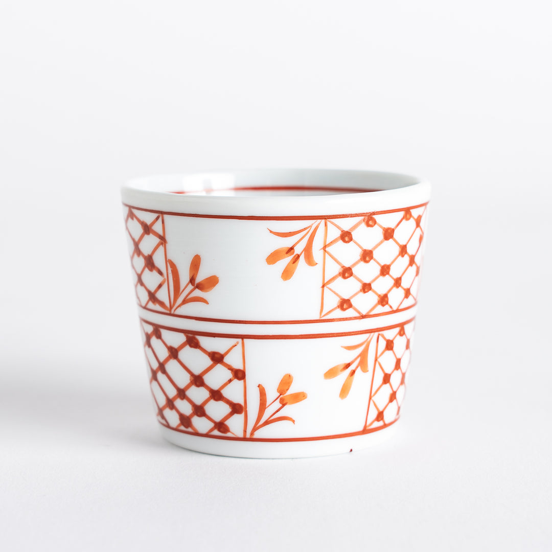 A condiment bowl featuring a geometric pattern of flowers within triangles, available in blue or red ink.