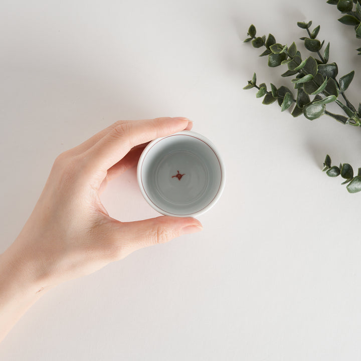 A condiment bowl featuring a geometric pattern of flowers within triangles, available in blue or red ink.