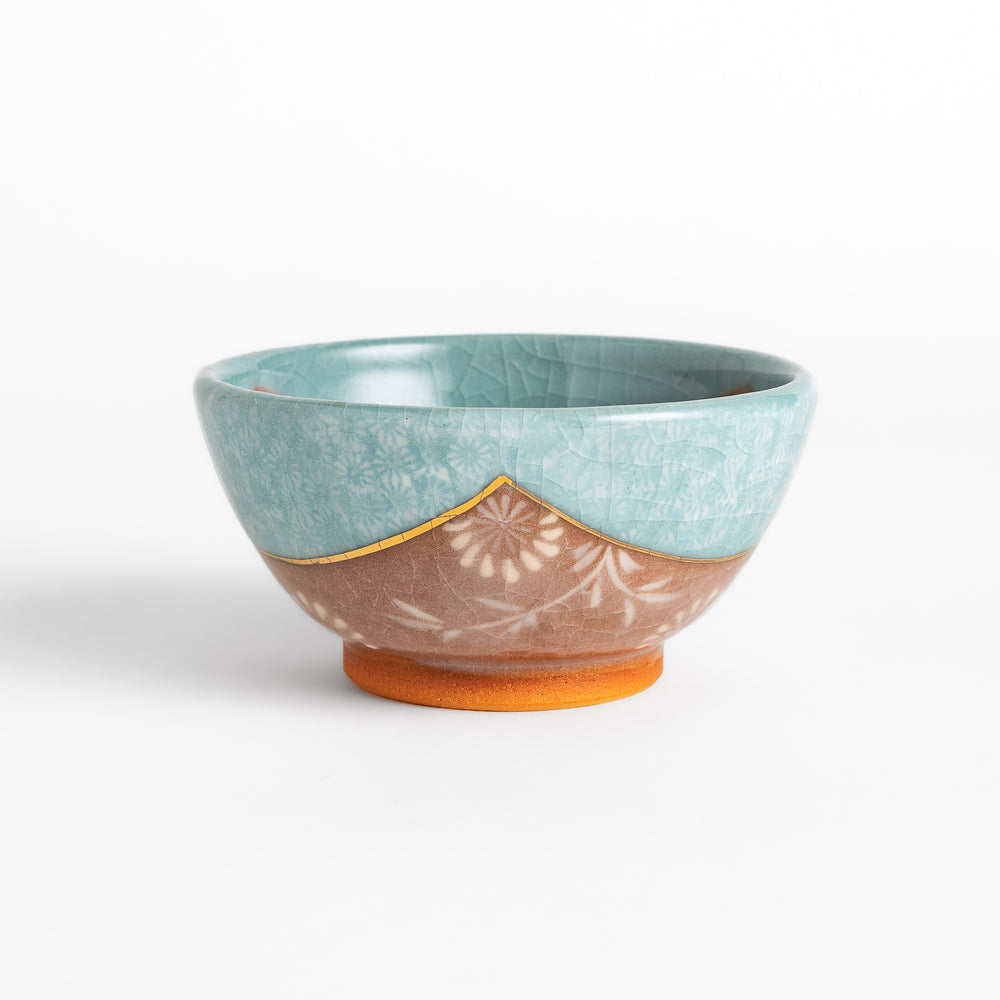 Authentic rice bowl, showcasing traditional Japanese artistry with a meticulously hand-painted, colorful floral motif.