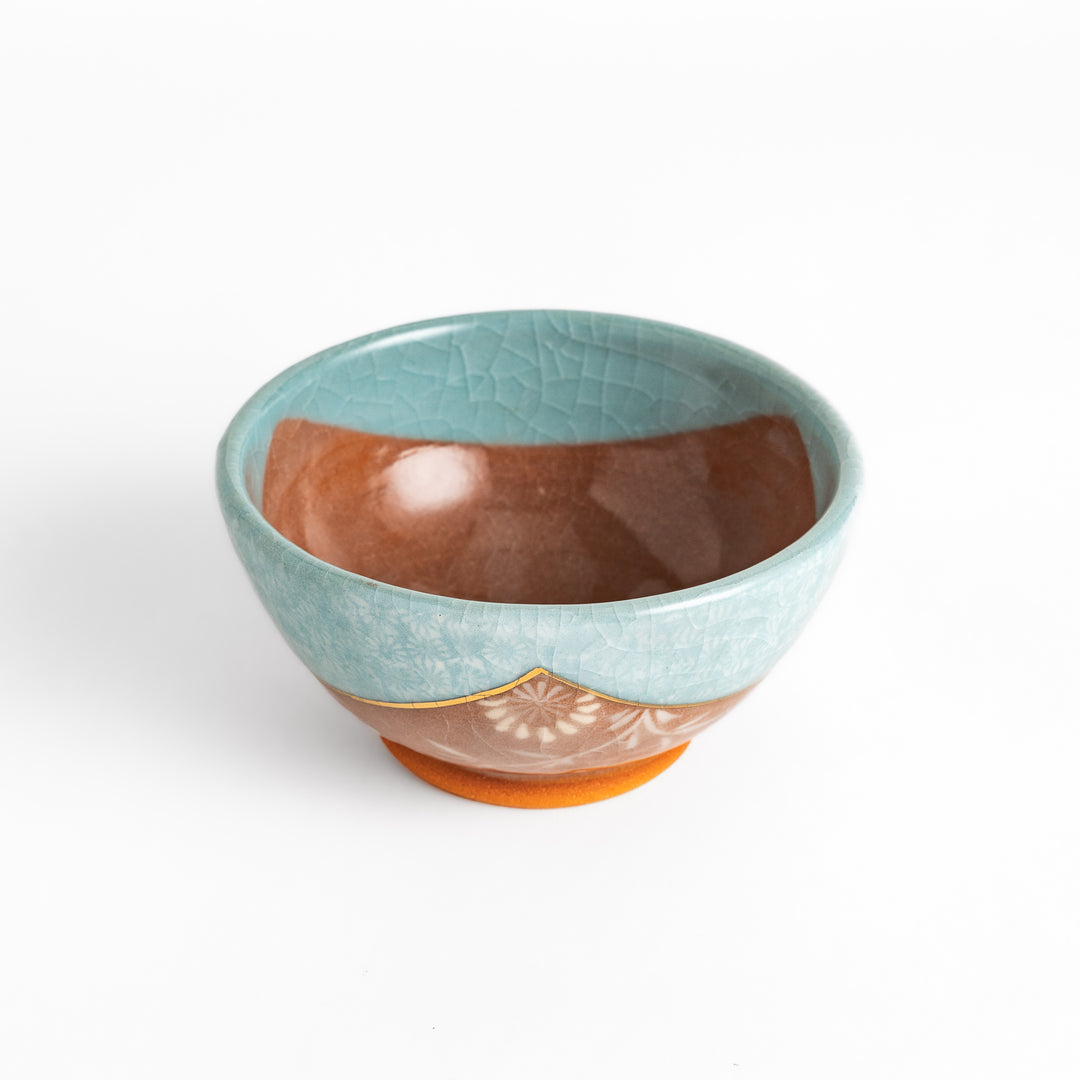 Authentic rice bowl, showcasing traditional Japanese artistry with a meticulously hand-painted, colorful floral motif.