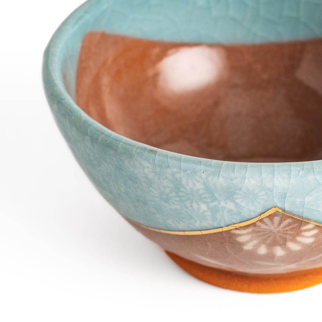 Authentic rice bowl, showcasing traditional Japanese artistry with a meticulously hand-painted, colorful floral motif.