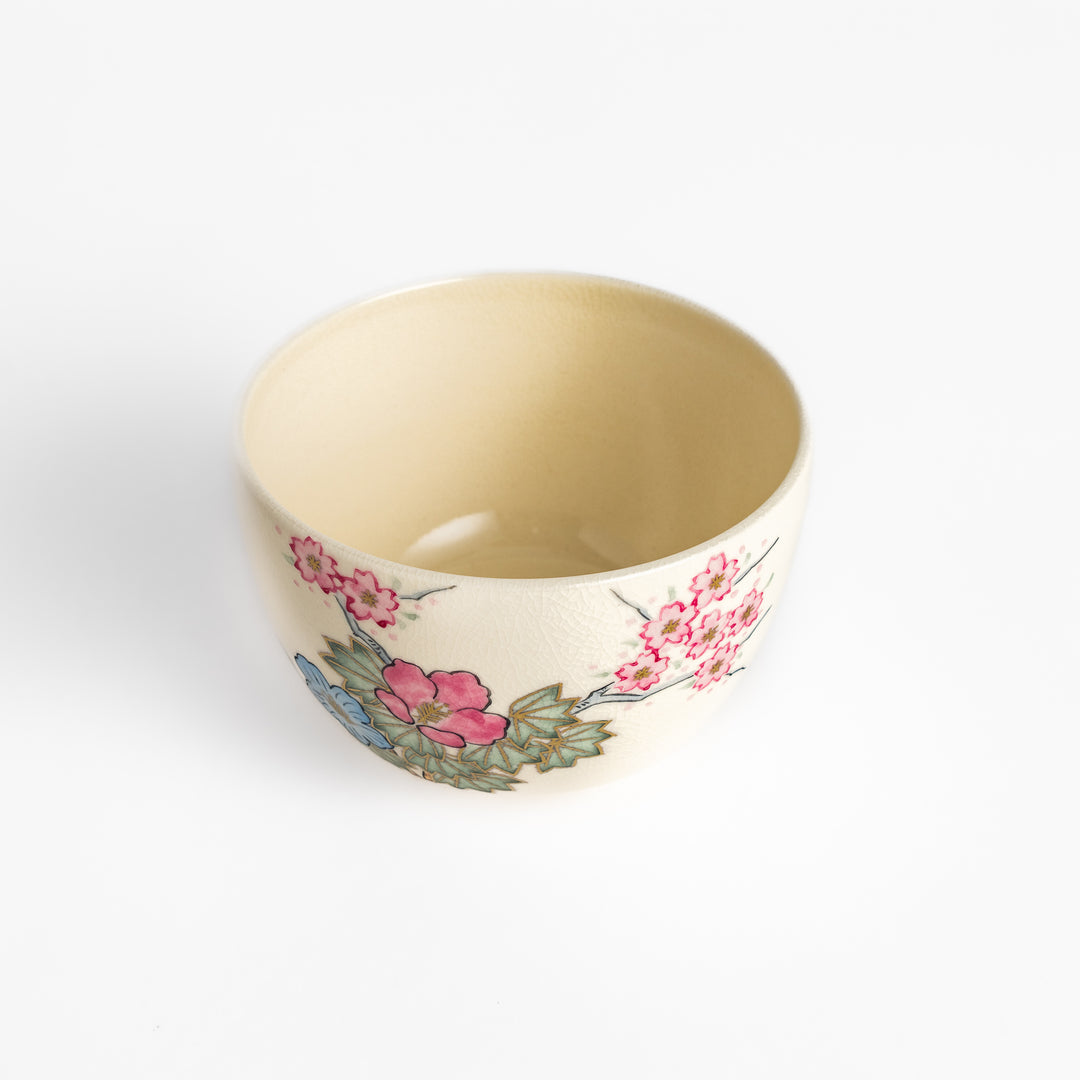 Handcrafted Matcha bowl with a pink and white floral design, ideal for enjoying a traditional Japanese tea ceremony.