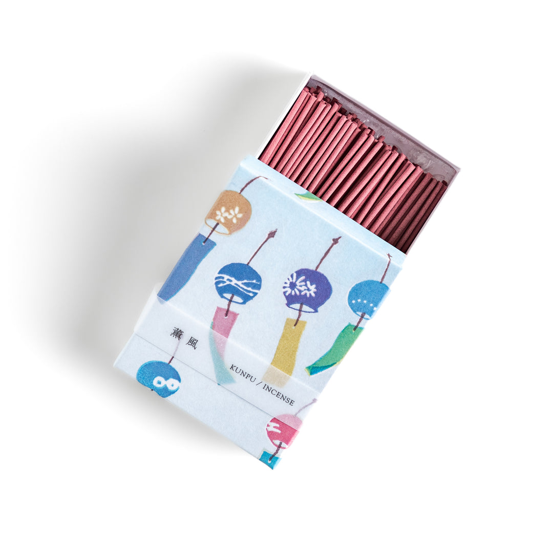 Incense featuring soft pink sticks in a box decorated with colorful Japanese wind chimes, evoking a light and refreshing fragrance reminiscent of a gentle summer breeze.