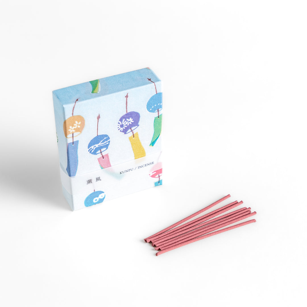 Incense featuring soft pink sticks in a box decorated with colorful Japanese wind chimes, evoking a light and refreshing fragrance reminiscent of a gentle summer breeze.