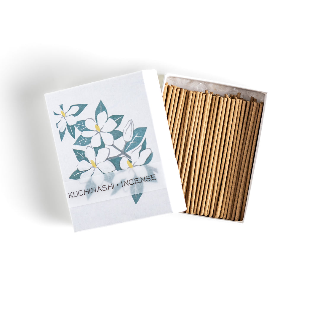 Incense featuring warm beige sticks in a box adorned with an elegant gardenia flower illustration, offering a rich, sweet floral fragrance for a soothing ambiance.