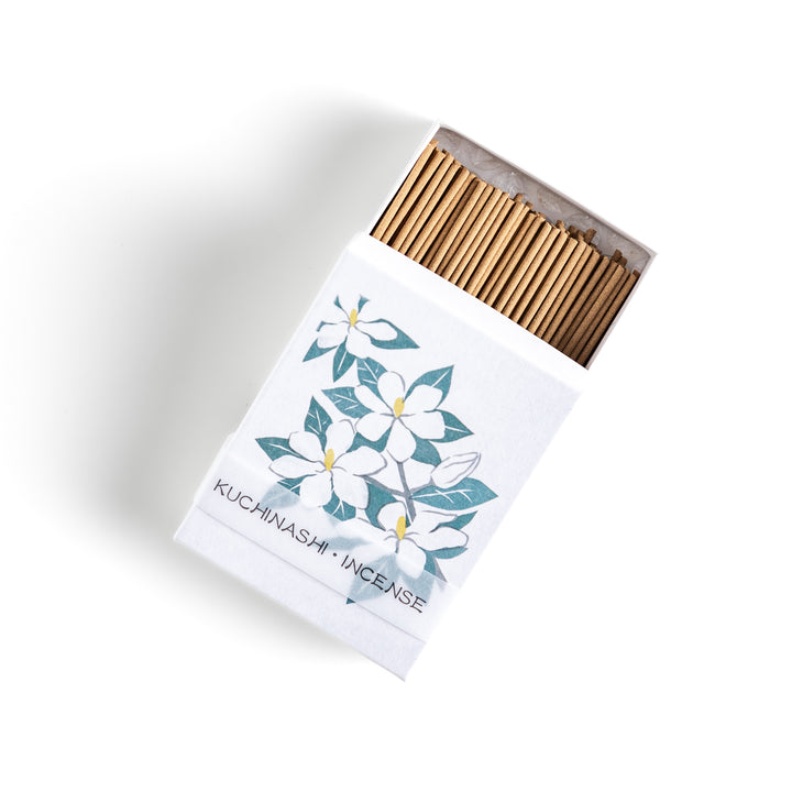 Incense featuring warm beige sticks in a box adorned with an elegant gardenia flower illustration, offering a rich, sweet floral fragrance for a soothing ambiance.