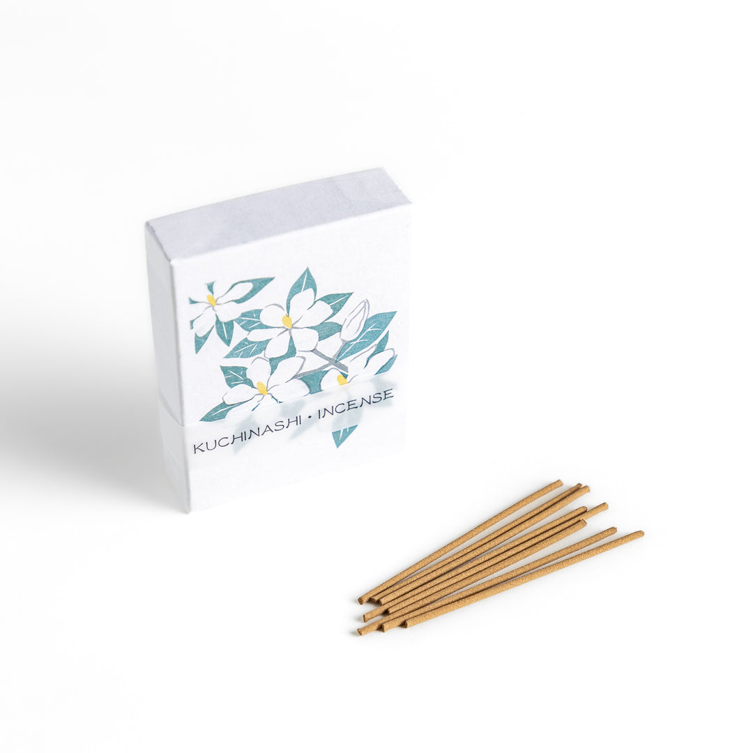 Incense featuring warm beige sticks in a box adorned with an elegant gardenia flower illustration, offering a rich, sweet floral fragrance for a soothing ambiance.