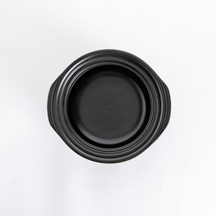 Donabe photographed from above with the lid removed, showcasing the spacious black interior.