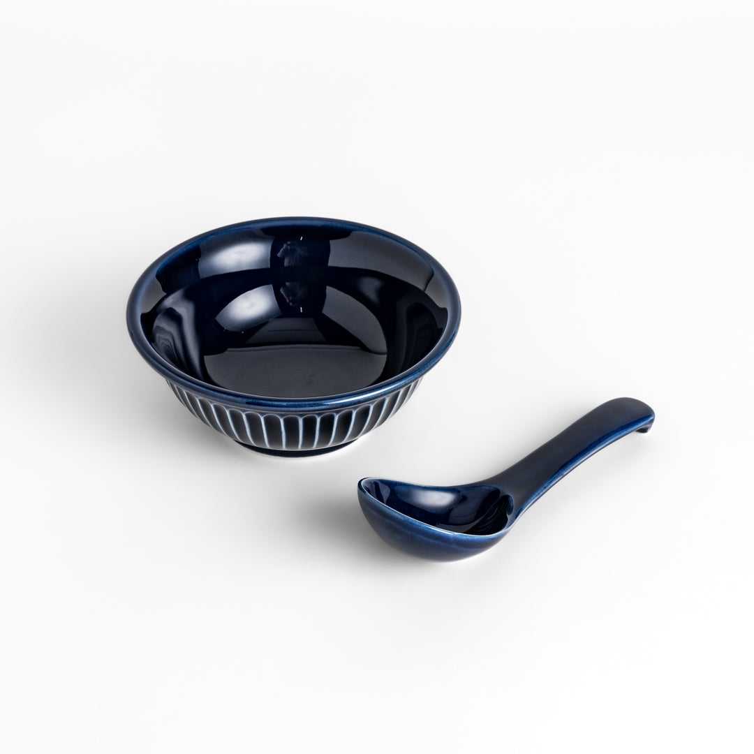 Stylish blue ceramic bowl and spoon set, perfect for enjoying your favorite soups or desserts.