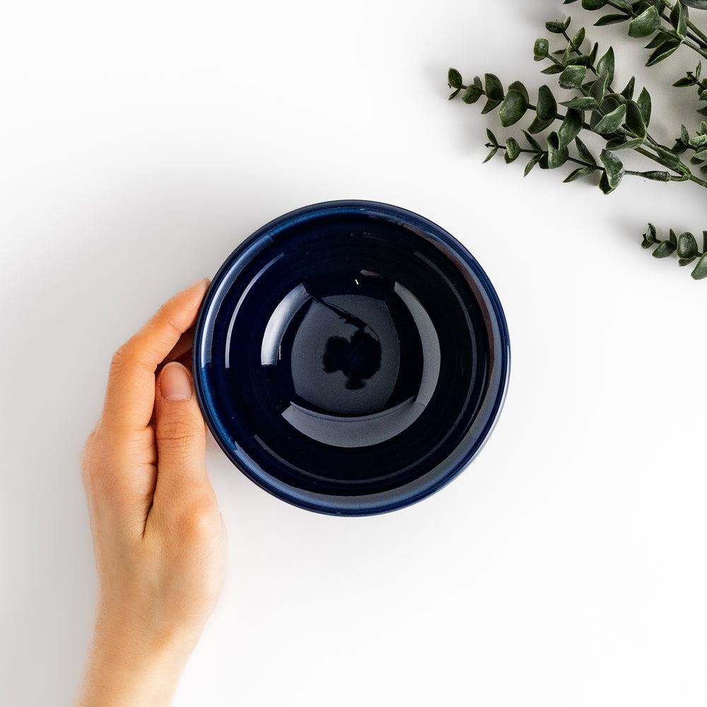 Stylish blue ceramic bowl featuring a unique ridged pattern, ideal for everyday use or special occasions.