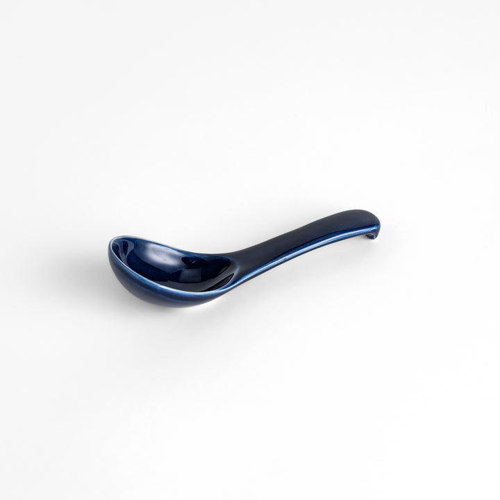 Durable and versatile blue ceramic spoon, perfect for both casual and formal dining.