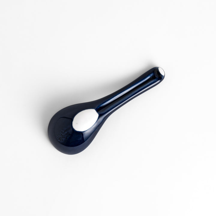 Durable and versatile blue ceramic spoon, perfect for both casual and formal dining.