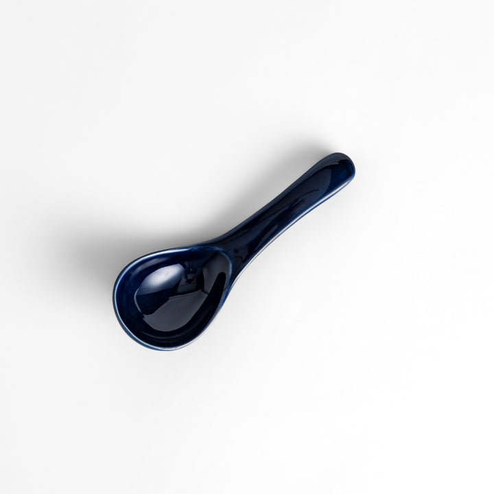 Durable and versatile blue ceramic spoon, perfect for both casual and formal dining.