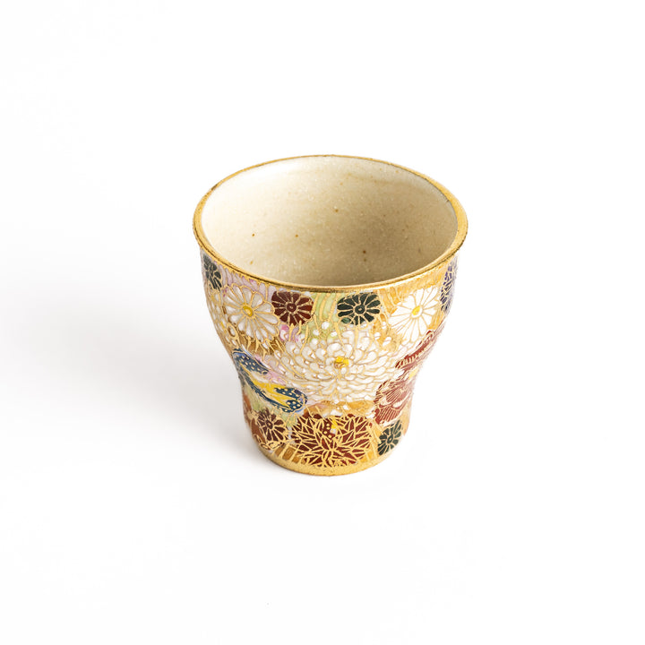 Elegant sake cup with a vibrant floral pattern in gold and pastel colors, perfect for savoring the delicate flavors of sake in style.