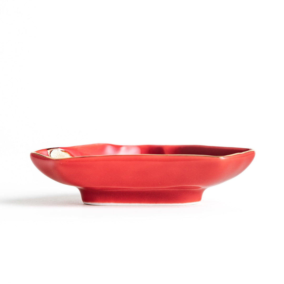 Mt. Fuji-shaped plate in red with a gold wave pattern.