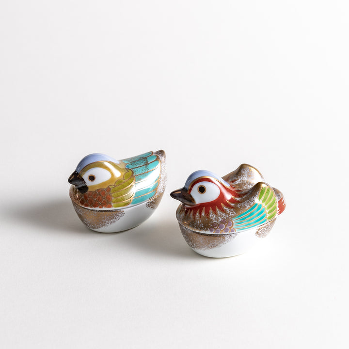 Set of two beautifully decorated bird-shaped condiment bowls, one with a golden drake design and the other with a hen design, featuring vibrant colors and intricate details.