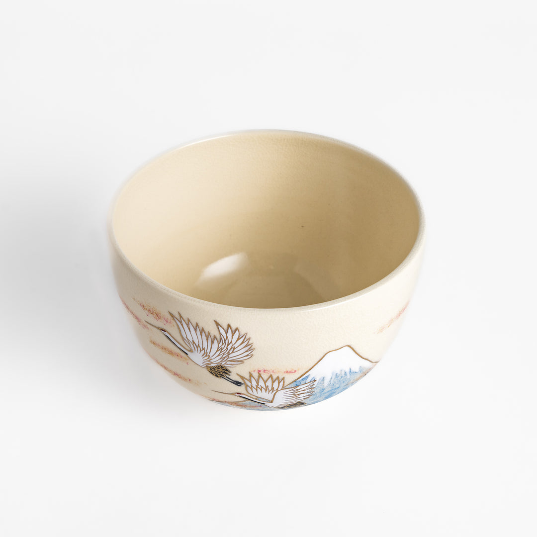 Elegant Matcha Bowl featuring a scenic design of Mount Fuji and flying cranes, accented with gold details for a luxurious tea experience.