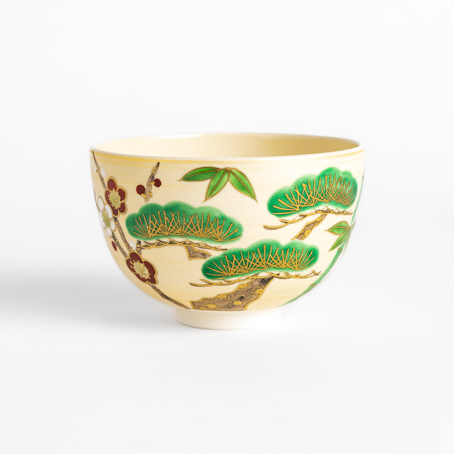 Golden Pine, Bamboo, and Plum Matcha Bowl featuring intricate green, gold, and red designs, perfect for enjoying matcha with elegance.