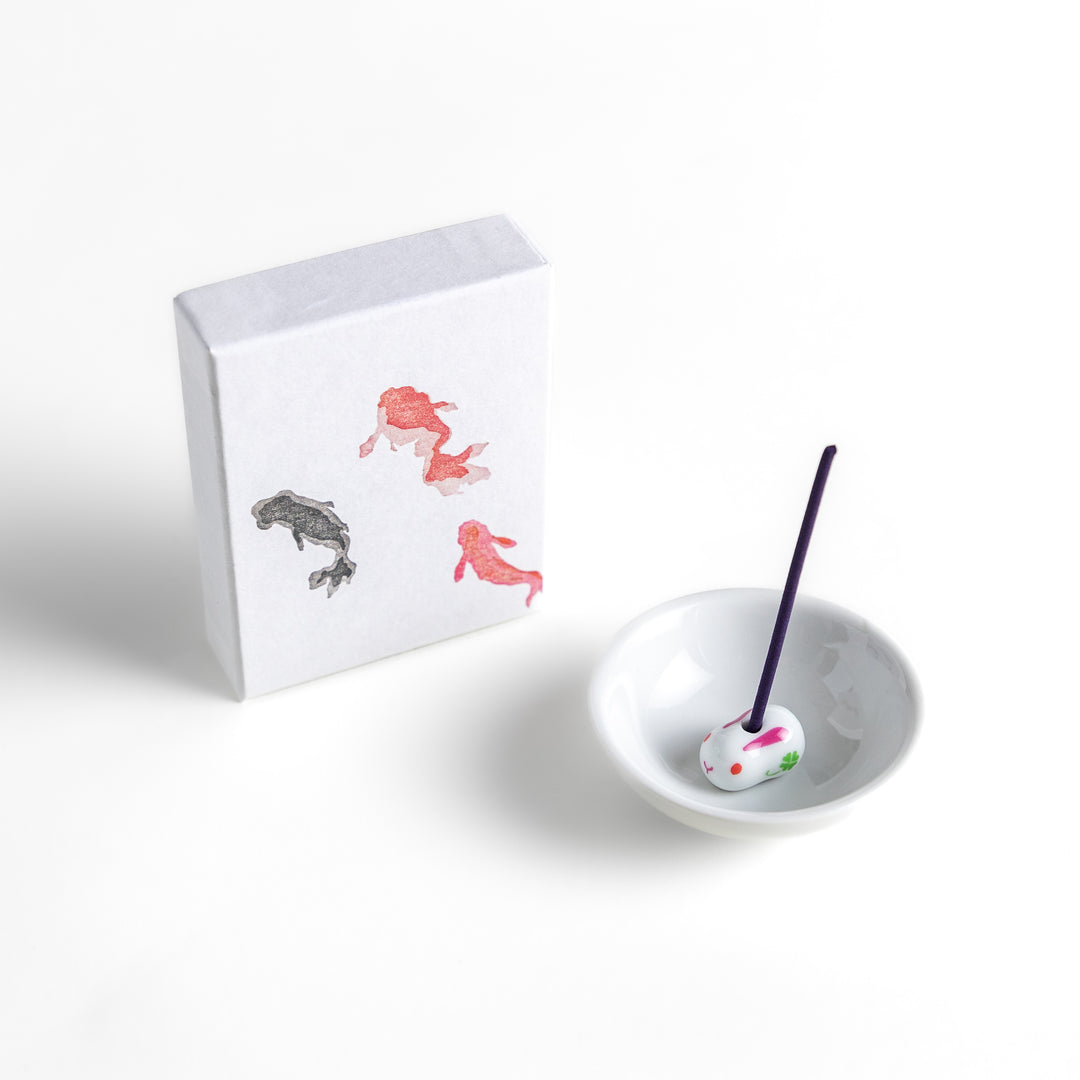 Incense featuring deep purple sticks in a box adorned with an elegant goldfish design, offering a tranquil and refreshing fragrance inspired by summer waters.