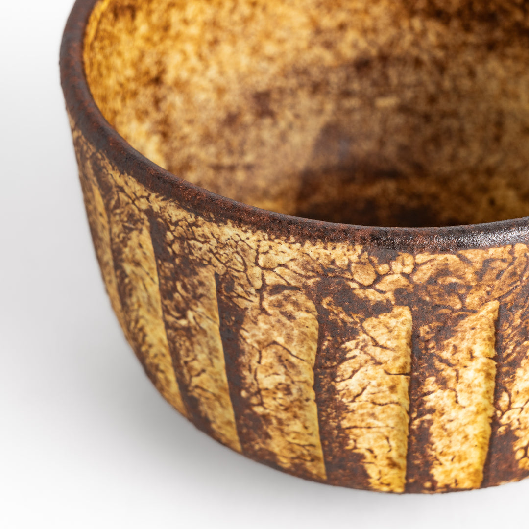 Rustic ceramic Matcha bowl with a textured, almost cracked glaze, perfect for a traditional Japanese tea ceremony.