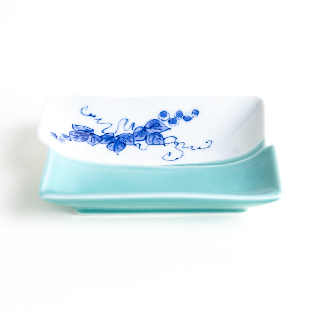 Rectangular plate with a blue floral grapevine design.