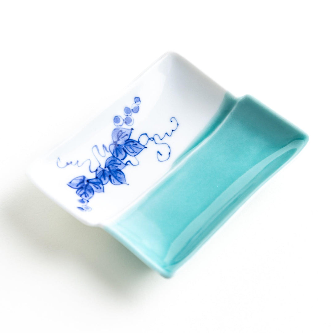 Rectangular plate with a blue floral grapevine design.