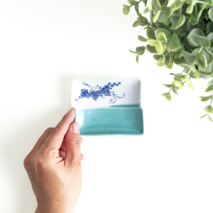 Rectangular plate with a blue floral grapevine design.