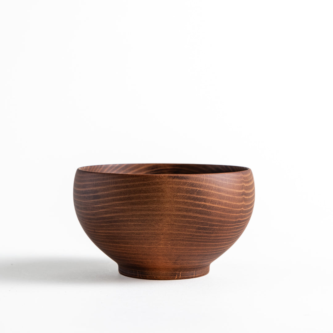 Dark brown handcrafted wooden bowl with a round base, showcasing fine wood grain details, perfect for serving soups.