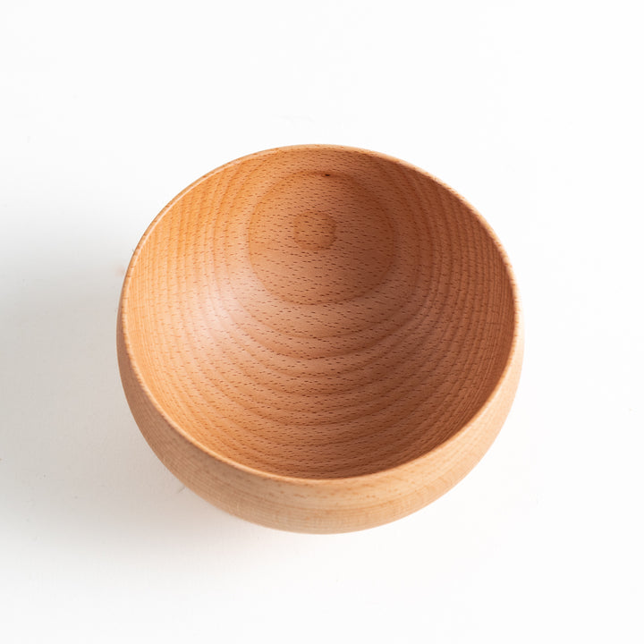 Top-down view of a beech wood bowl, emphasizing its deep interior and fine craftsmanship. Great for miso soup or snacks.