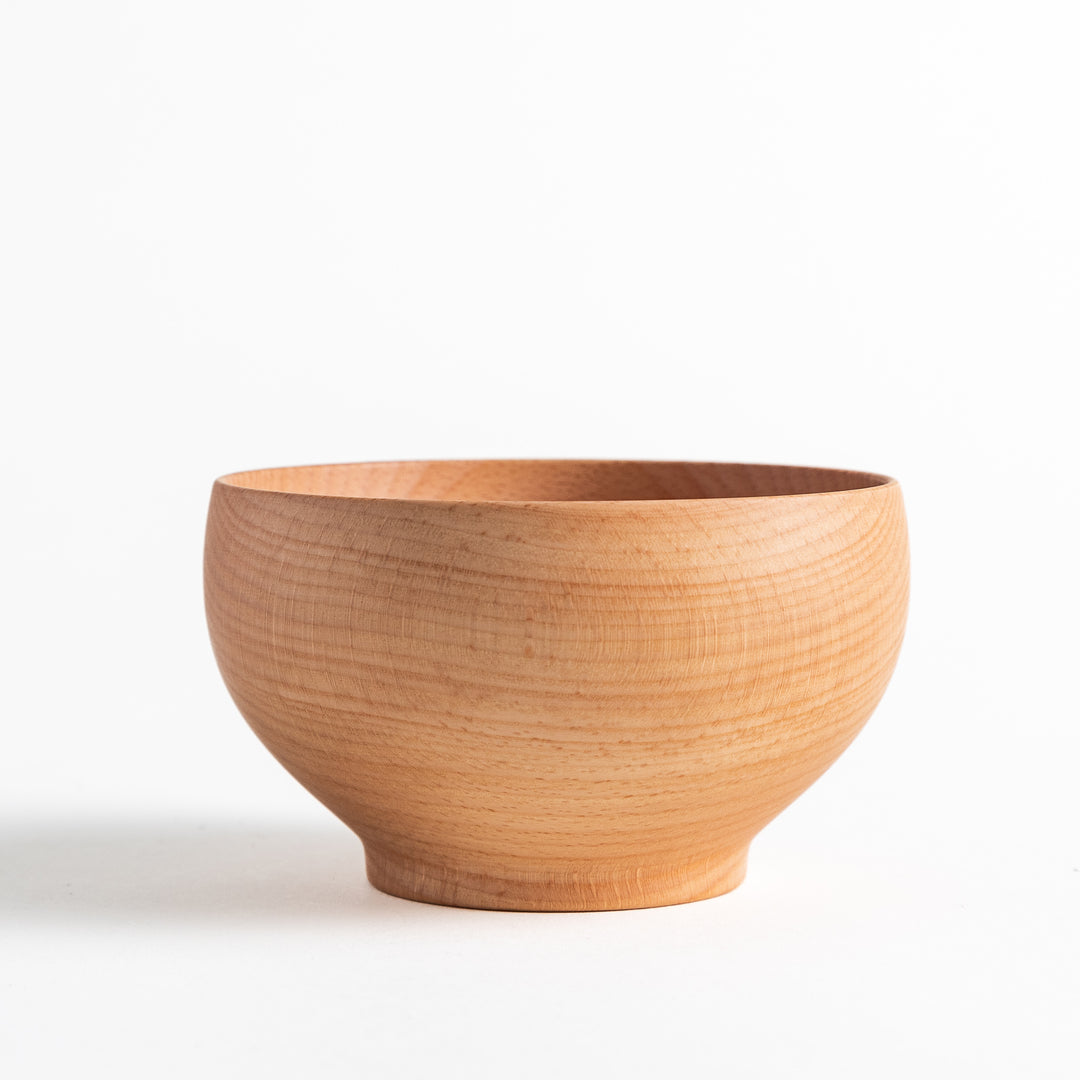 Beech wood bowl showcasing smooth grain and a natural finish. Ideal for serving miso soup or other delicious dishes.