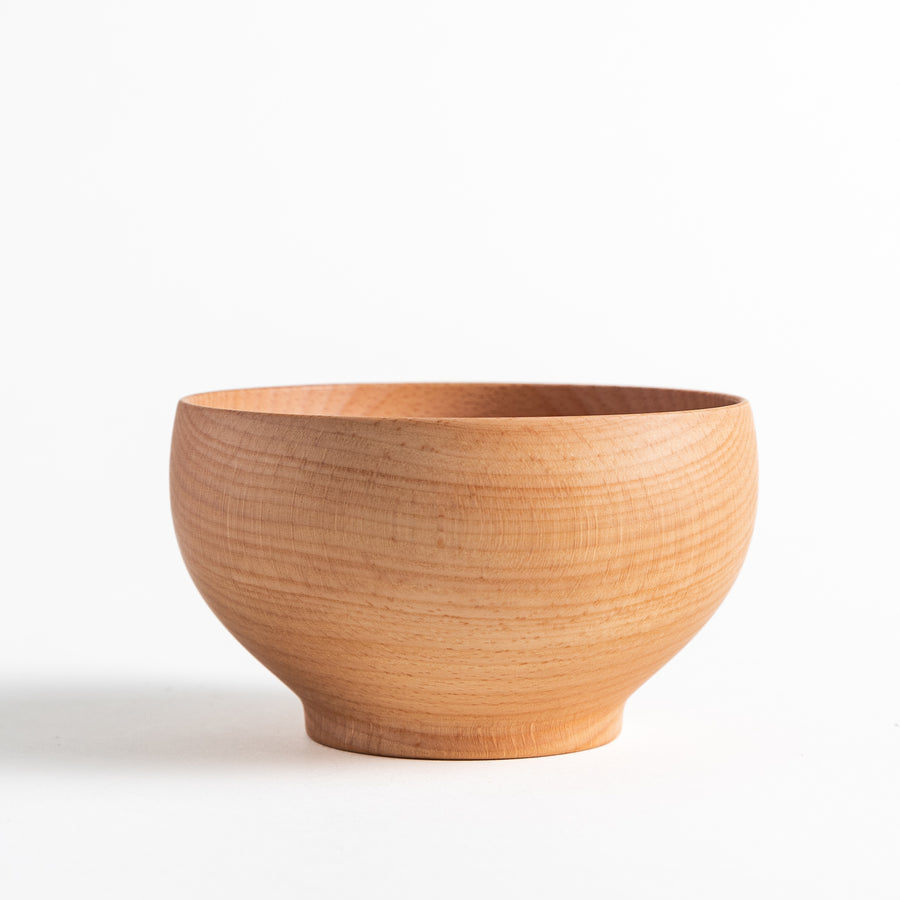 Beech wood bowl showcasing smooth grain and a natural finish. Ideal for serving miso soup or other delicious dishes.