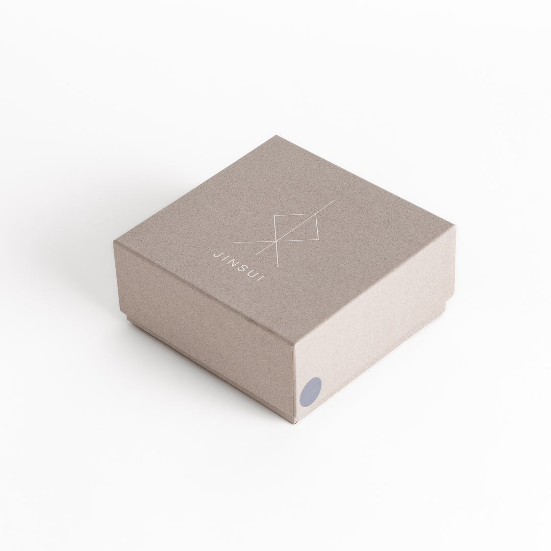 Packaging box for the gray teacups, designed for secure storage with a minimalist presentation.