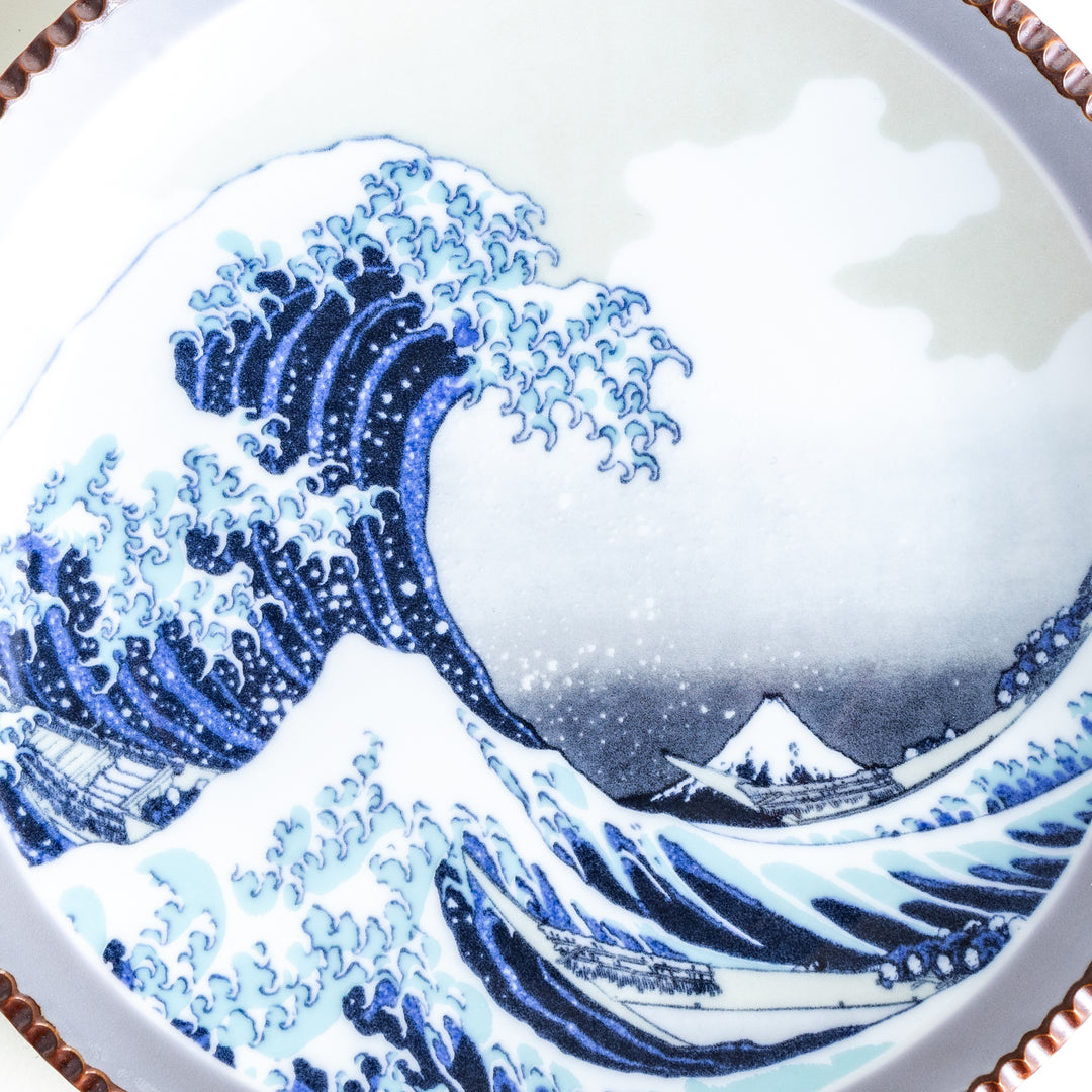 Ceramic salad plate featuring a classic image of The Great Wave off Kanagawa with a unique hammered copper rim.