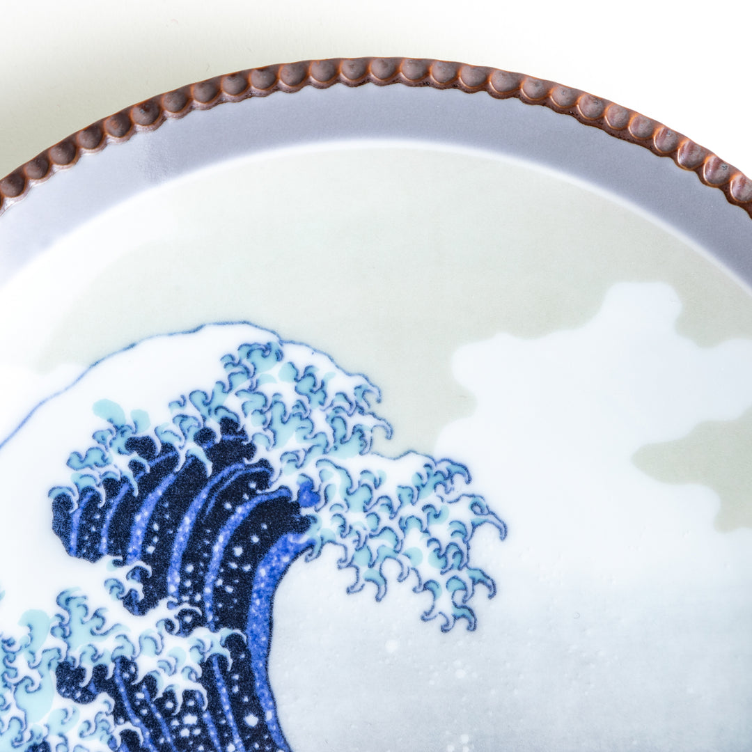 Ceramic salad plate featuring a classic image of The Great Wave off Kanagawa with a unique hammered copper rim.