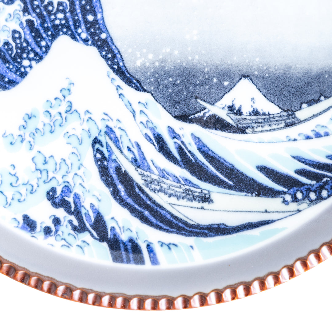 Ceramic salad plate featuring a classic image of The Great Wave off Kanagawa with a unique hammered copper rim.