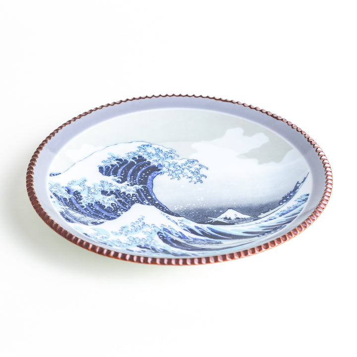 Ceramic salad plate featuring a classic image of The Great Wave off Kanagawa with a unique hammered copper rim.