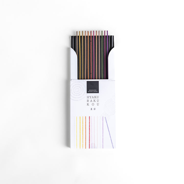 Incense set featuring a variety of vibrant sticks elegantly packaged in a sleek white box with subtle circular patterns, offering a diverse selection of rich and captivating aromas.