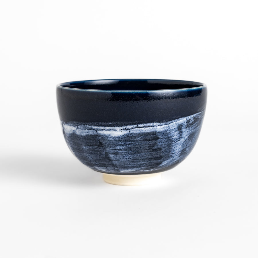 Artistic ceramic Matcha Bowl with a striking two-tone glaze and a rustic wabi-sabi feel.