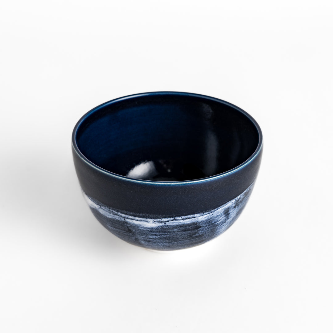 Artistic ceramic Matcha Bowl with a striking two-tone glaze and a rustic wabi-sabi feel.