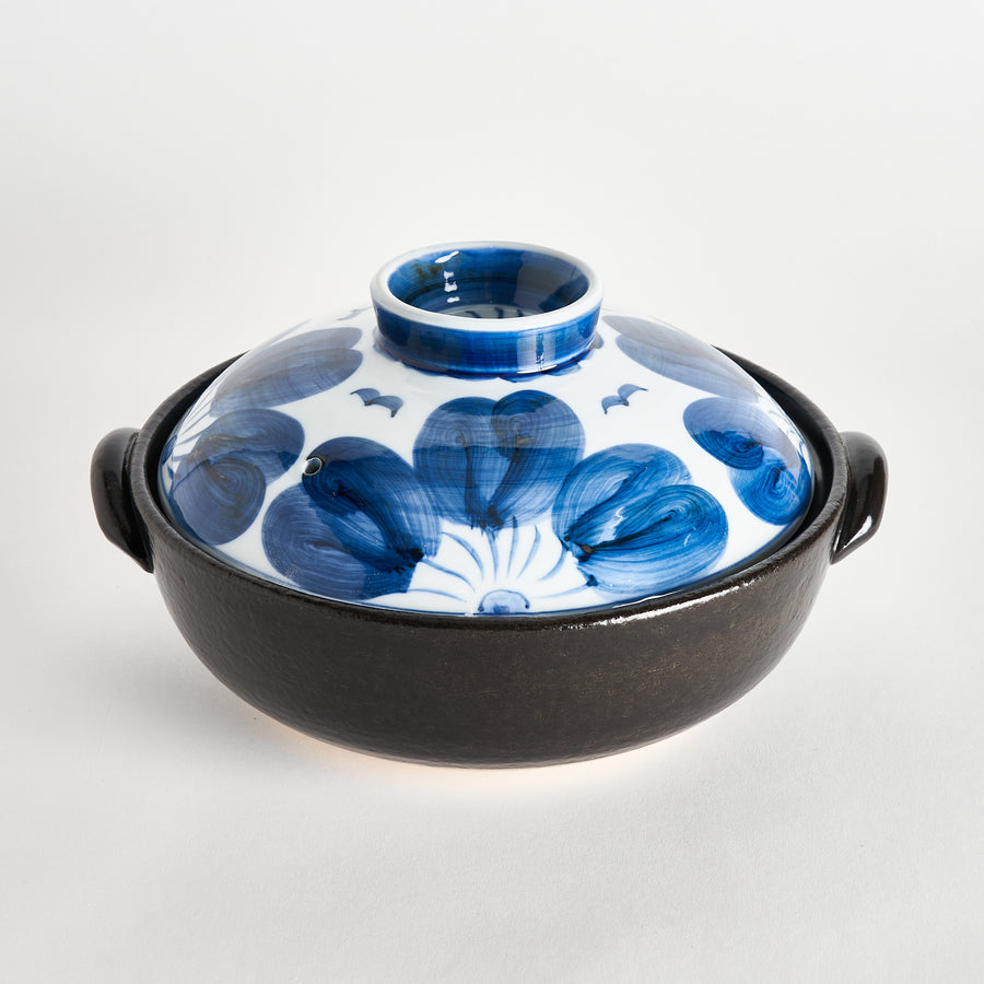 A beautiful donabe with an indigo floral design, combining traditional craftsmanship and modern style.