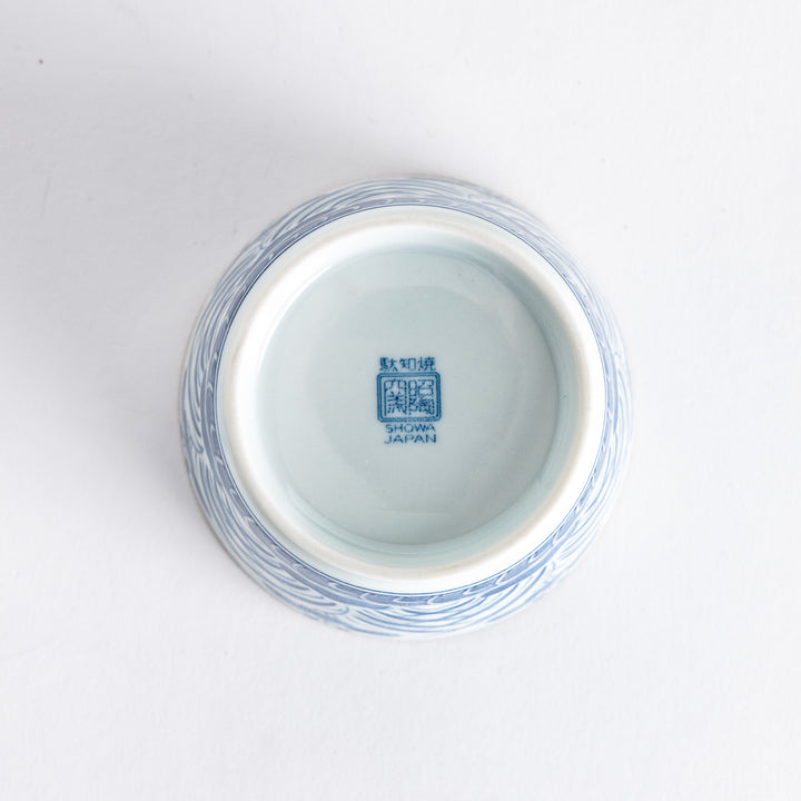 Underside of the bowl, featuring a smooth surface with a blue manufacturer mark, emphasizing quality craftsmanship.