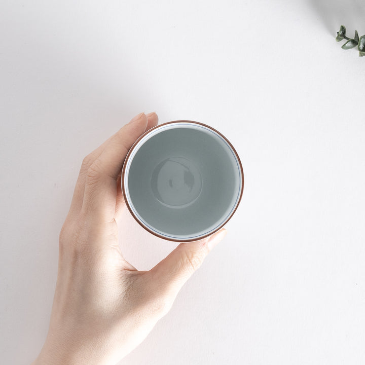 Top view of the Ivory Fluted Tea Cup, showing its smooth interior and subtle blue rim detail.