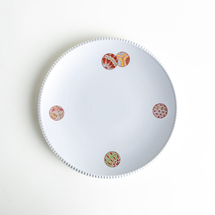 Elegant dinner plate adorned with traditional Japanese temari ball motifs, adding a touch of cultural charm to your dining table.