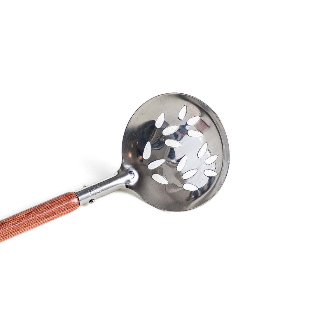 Durable wooden and stainless steel skimmer, essential kitchenware for cooking.